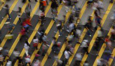ATTENTION EDITORS - IMAGE 1 OF 22 OF PICTURE PACKAGE '7 BILLION, 7 STORIES - OVERCROWDED IN HONG KONG. SEARCH 'MONG KOK' FOR ALL IMAGES - People cross a street in Mong Kok district in Hong Kong, October 4, 2011. Mong Kok has the highest population density in the world, with 130,000 in one square kilometre. The world's population will reach seven billion on 31 October 2011, according to projections by the United Nations, which says this global milestone presents both an opportunity and a challenge for the planet. While more people are living longer and healthier lives, says the U.N., gaps between rich and poor are widening and more people than ever are vulnerable to food insecurity and water shortages.   Picture taken October 4, 2011.   REUTERS/Bobby Yip   (CHINA - Tags: SOCIETY) - LM2E7AE147B01