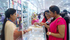 Women purchase jewelry at a shop counter in Bangladesh