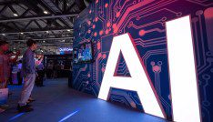 A signage of Artificial Intelligence (AI) is seen at the stand of Xiaomi during the 2018 China Mobile Global Partner Conference in Guangzhou city, south China's Guangdong province.