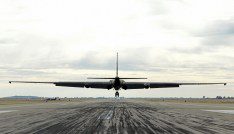 A U-2 spy plane that is being used to test AI applications lands at an air field.