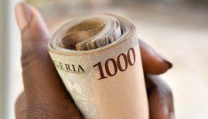 Sub-Saharan Africa’s debt problem: Mapping the pandemic’s effect and the way forward 7 A hand holding a roll of 1000 naira notes