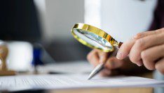 Who should regulate: Chairs or majorities of the board 4 Auditor Doing Tax Fraud Investigation Using Magnifying Glass